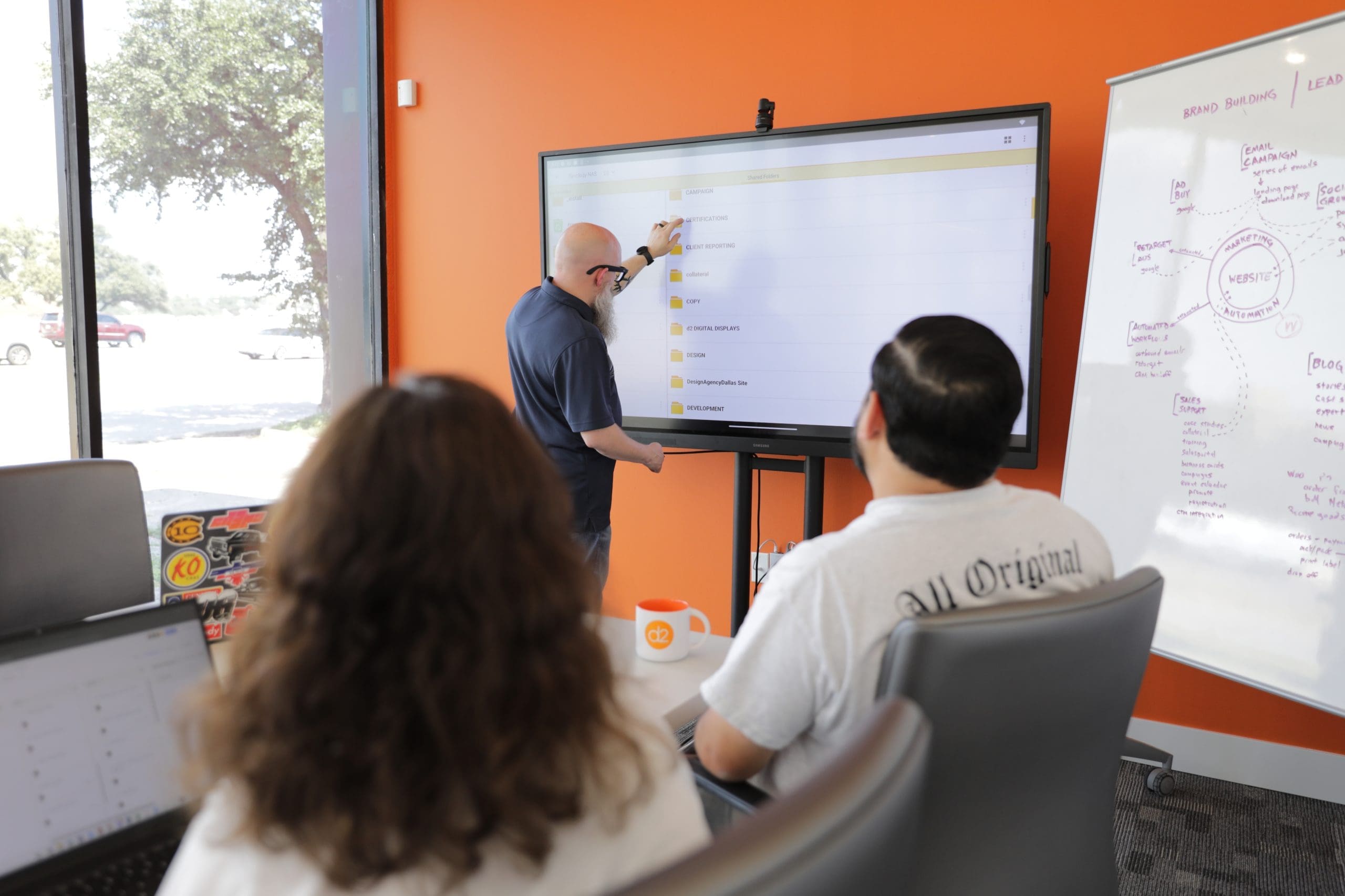 D2 team member presenting ideas in the studio